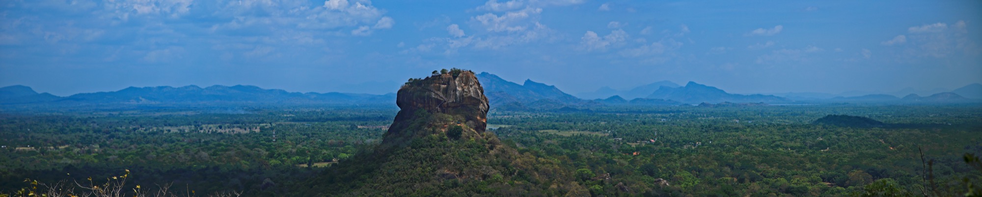 Sigiriya rock rising above Sri Lanka’s green landscape